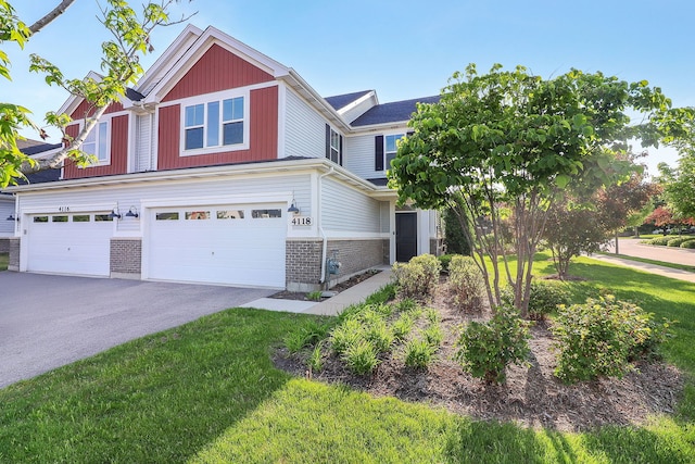 4118 Calder Ln, Aurora, IL 60504 - view of front of home with an attached garage, driveway, and a front yard