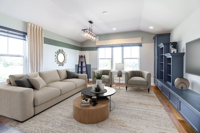 4118 Calder Ln, Aurora, IL 60504 - living area featuring vaulted ceiling, wood finished floors, plenty of natural light, and recessed lighting