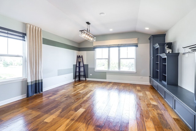 4118 Calder Ln, Aurora, IL 60504 - unfurnished living room with lofted ceiling, hardwood / wood-style floors, plenty of natural light, and baseboards