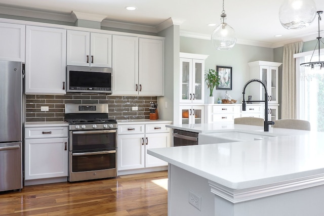 4118 Calder Ln, Aurora, IL 60504 - kitchen with stainless steel appliances, light countertops, crown molding, white cabinetry, and recessed lighting