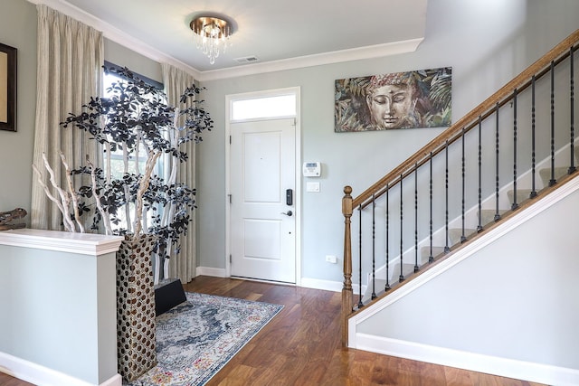 4118 Calder Ln, Aurora, IL 60504 - entrance foyer featuring wood finished floors, stairs, baseboards, crown molding, and a chandelier