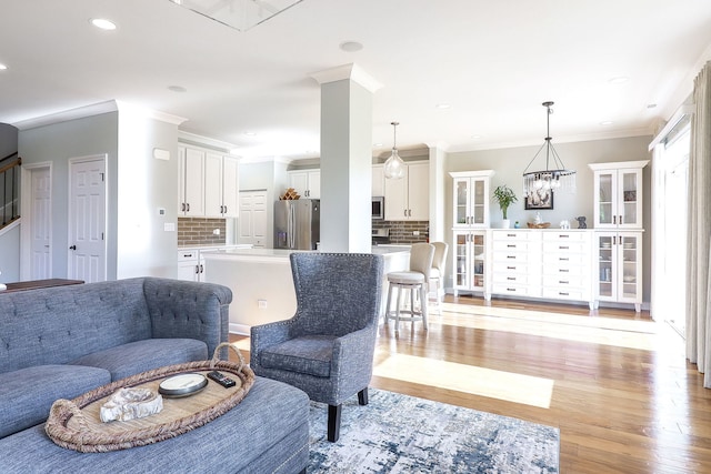 4118 Calder Ln, Aurora, IL 60504 - living room with light wood-style flooring, ornamental molding, stairs, and recessed lighting