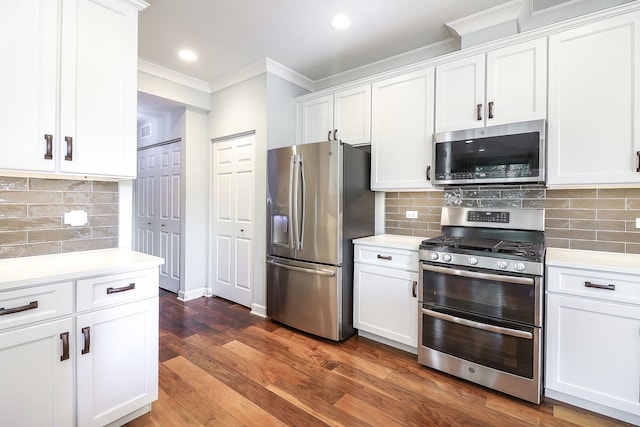 4118 Calder Ln, Aurora, IL 60504 - kitchen featuring stainless steel appliances, crown molding, light countertops, white cabinets, and backsplash