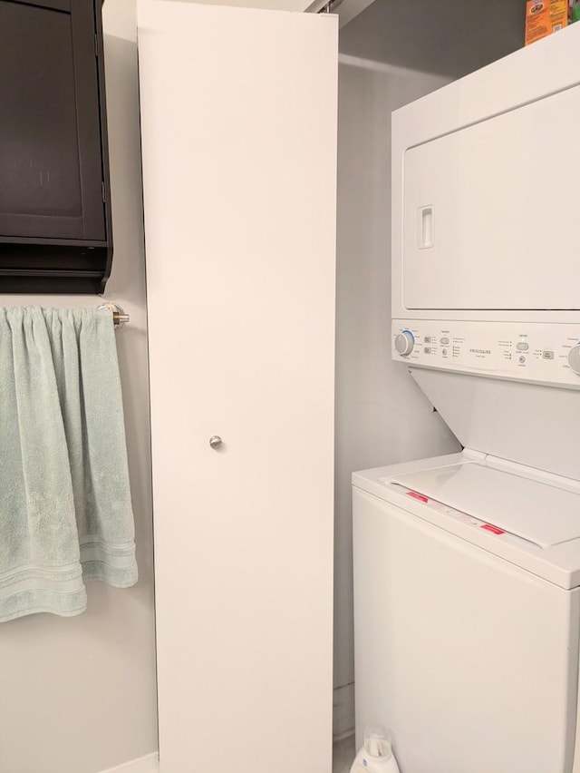 33 W Ontario St Unit 40D, Chicago, IL 60654 - washroom featuring stacked washer / dryer