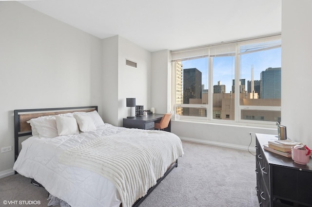 33 W Ontario St Unit 40D, Chicago, IL 60654 - carpeted bedroom featuring a view of city, baseboards, and visible vents