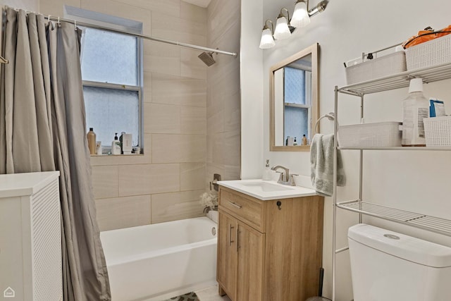 full bath featuring vanity, shower / bathtub combination with curtain, and toilet