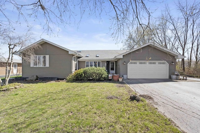 single story home with an attached garage, driveway, and a front lawn