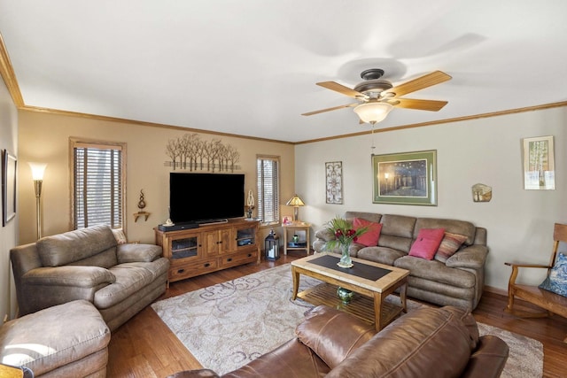 living area featuring crown molding, a ceiling fan, and wood finished floors