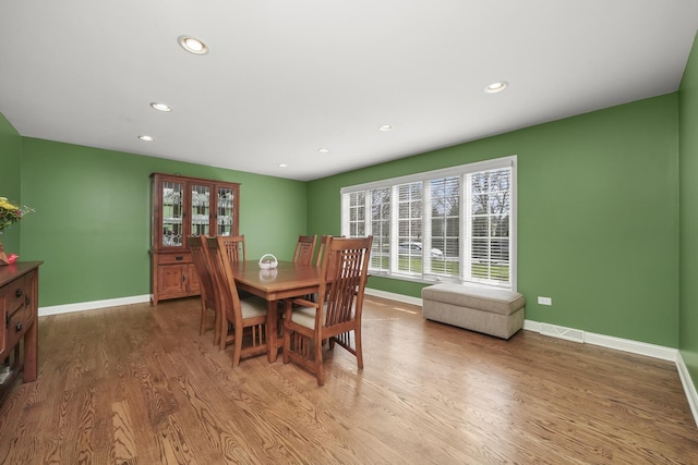 dining area with recessed lighting, baseboards, visible vents, and wood finished floors