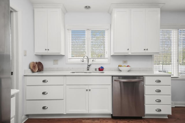 kitchen featuring a sink, light countertops, white cabinets, and stainless steel dishwasher