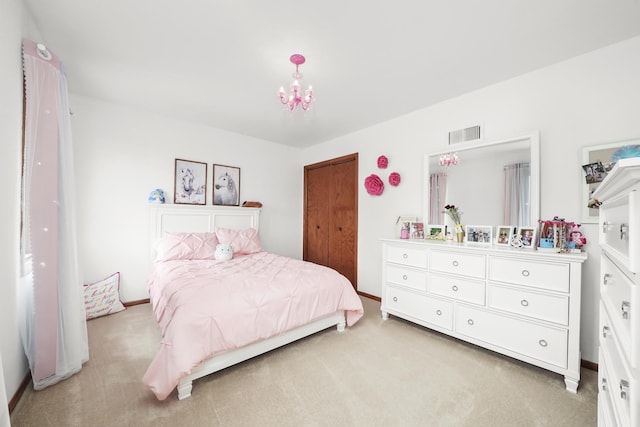 bedroom with light colored carpet, a notable chandelier, and visible vents