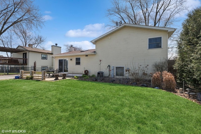 2018 Fairfield Rd, Lindenhurst, IL 60046 - rear view of house with a yard, a patio, fence, and a chimney