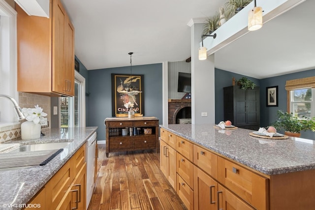 2018 Fairfield Rd, Lindenhurst, IL 60046 - kitchen featuring a sink, light stone countertops, vaulted ceiling, and wood finished floors