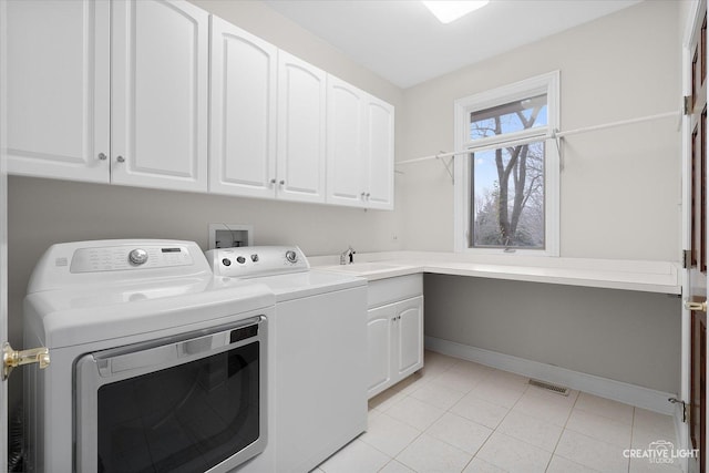 70 New Abbey Dr, Inverness, IL 60010 - laundry area with light tile patterned floors, cabinet space, a sink, baseboards, and washing machine and dryer