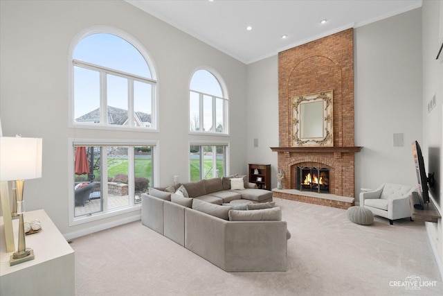 70 New Abbey Dr, Inverness, IL 60010 - carpeted living room featuring crown molding, recessed lighting, a fireplace, and a towering ceiling