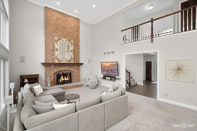 70 New Abbey Dr, Inverness, IL 60010 - carpeted living area with crown molding, baseboards, stairs, and a fireplace