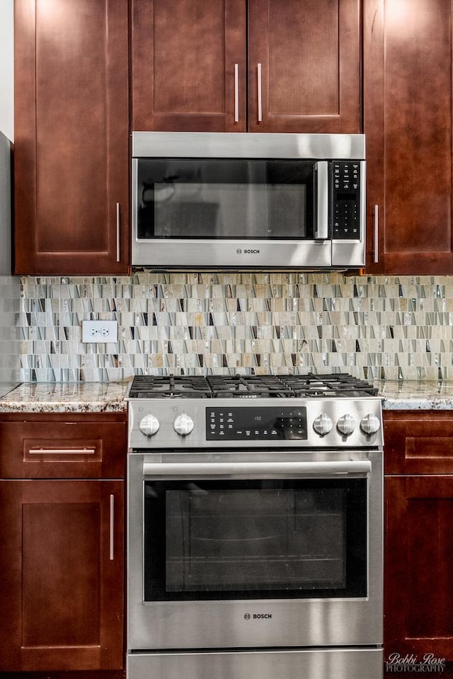 208 Brookdale Ln, Palatine, IL 60067 - kitchen with appliances with stainless steel finishes, light stone countertops, and decorative backsplash