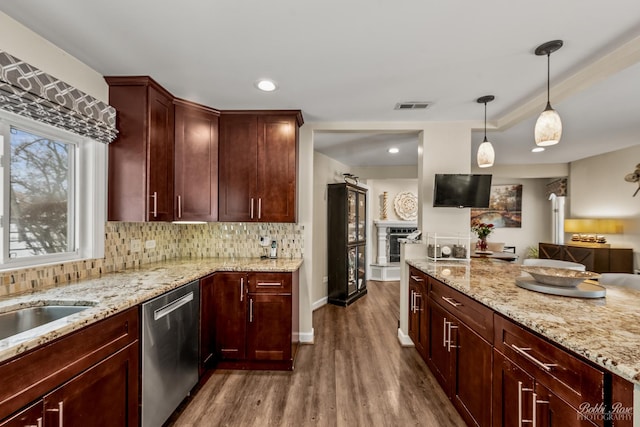 kitchen featuring decorative backsplash, stainless steel dishwasher, dark wood finished floors, and visible vents
