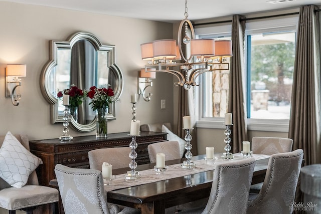 dining room with a notable chandelier and visible vents