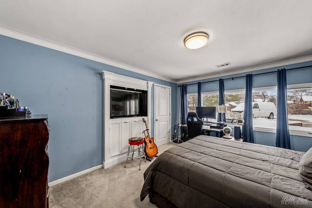 carpeted bedroom featuring visible vents, baseboards, and ornamental molding