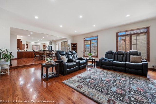 living area with recessed lighting and wood finished floors