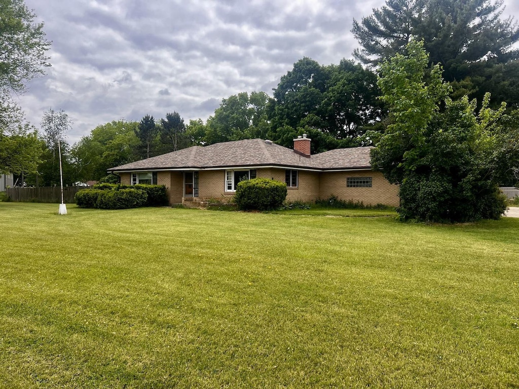 1320 N Il Rte 2, Oregon, IL 61061 - rear view of property with a lawn, a chimney, and brick siding