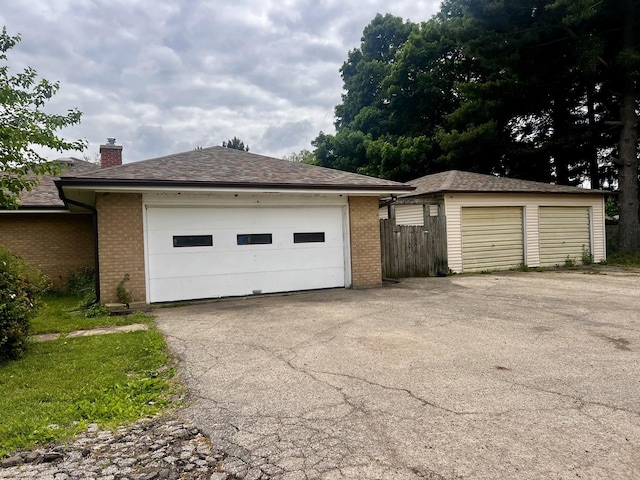 1320 N Il Rte 2, Oregon, IL 61061 - view of side of property with brick siding, an outbuilding, a chimney, and a detached garage