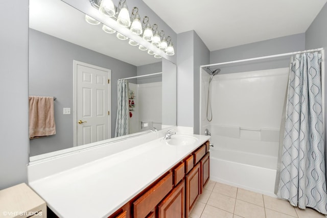 full bathroom featuring shower / bath combo with shower curtain, tile patterned flooring, and vanity