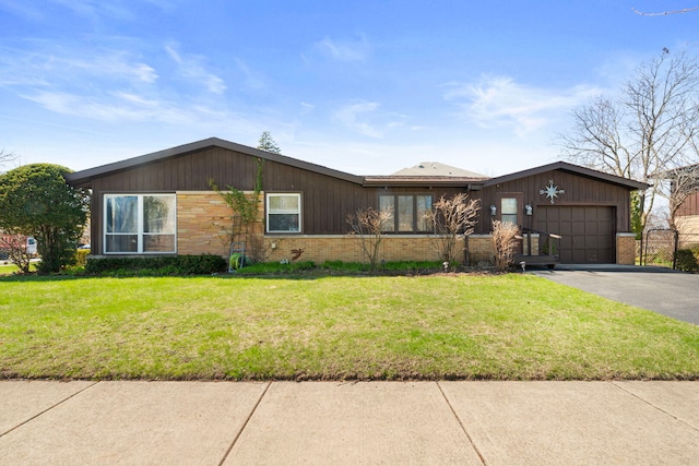 6802 Lyons St, Morton Grove, IL 60053 - ranch-style house with aphalt driveway, brick siding, an attached garage, and a front yard