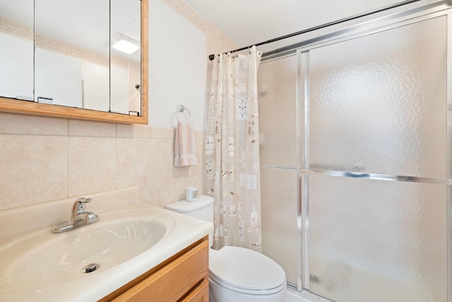 6802 Lyons St, Morton Grove, IL 60053 - bathroom featuring vanity, toilet, a shower stall, decorative backsplash, and tile walls