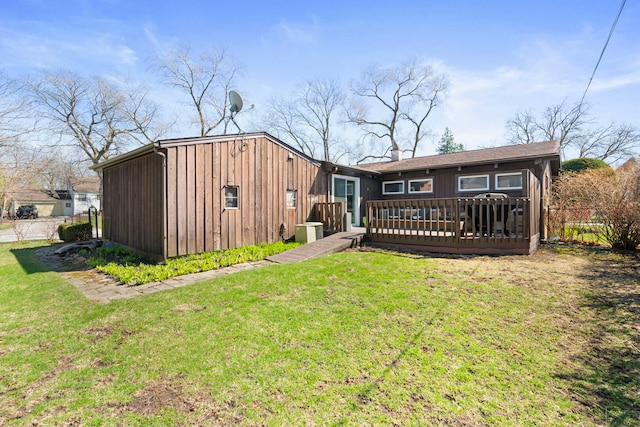 6802 Lyons St, Morton Grove, IL 60053 - rear view of property featuring a yard, a deck, and central AC