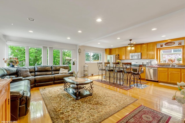 8936 N Elmore St, Niles, IL 60714 - living room featuring ceiling fan, baseboards, light wood-style floors, and recessed lighting