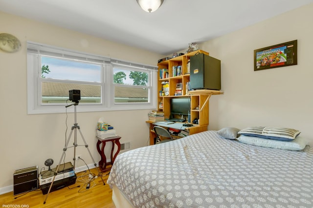 8936 N Elmore St, Niles, IL 60714 - bedroom with wood finished floors and baseboards