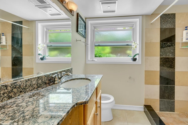 8936 N Elmore St, Niles, IL 60714 - full bathroom with toilet, vanity, tile patterned floors, and a walk in shower