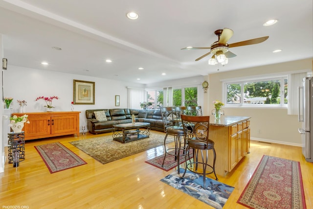 8936 N Elmore St, Niles, IL 60714 - interior space with freestanding refrigerator, recessed lighting, light wood-style floors, a ceiling fan, and a breakfast bar