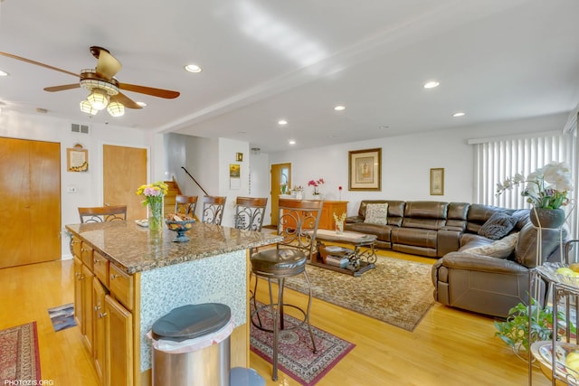 8936 N Elmore St, Niles, IL 60714 - living room with recessed lighting, light wood-style floors, visible vents, and ceiling fan