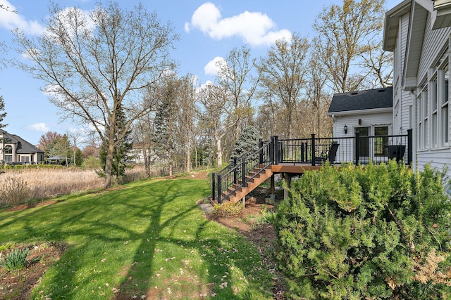 view of yard with stairs and a wooden deck