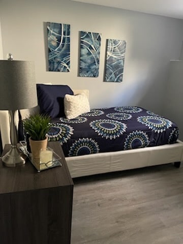 bedroom featuring wood finished floors