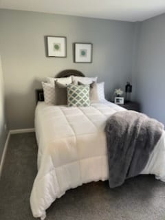 carpeted bedroom with baseboards