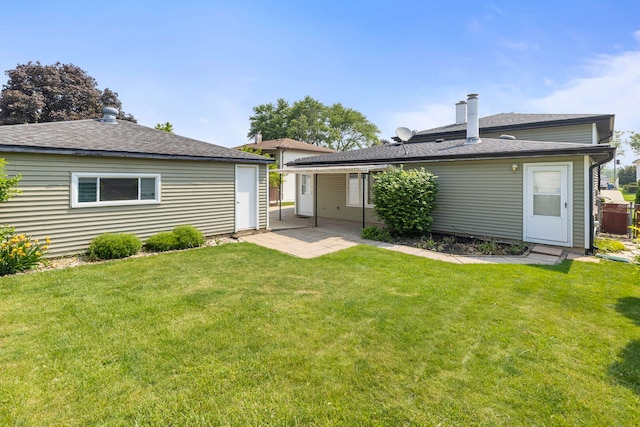 118 S Clarendon Ave, Addison, IL 60101 - back of property with a lawn, a patio, and roof with shingles