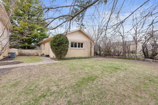 view of yard with cooling unit and fence