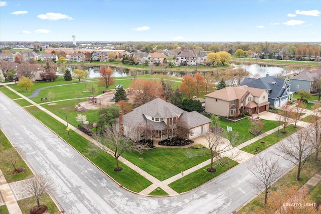 bird's eye view with a residential view and a water view