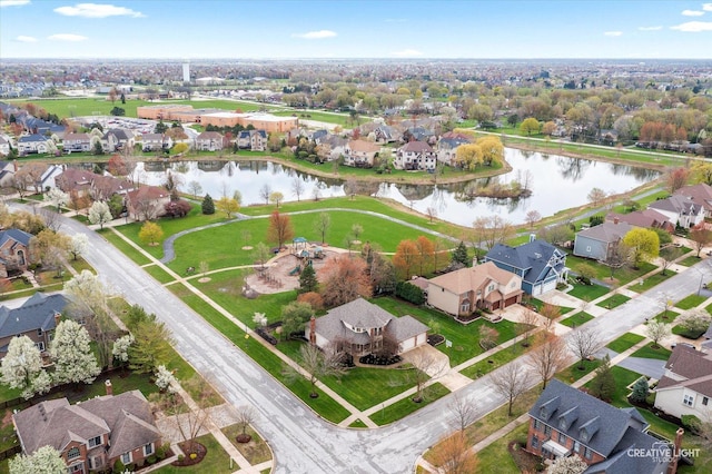 aerial view featuring a residential view and a water view