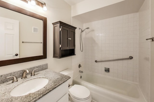 full bath featuring toilet, vanity, washtub / shower combination, and visible vents