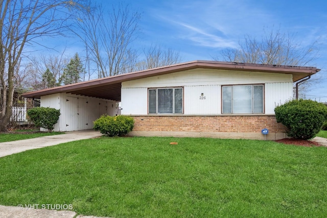 226 Shabbona Dr, Park Forest, IL 60466 - exterior space with an attached carport, a yard, brick siding, and driveway