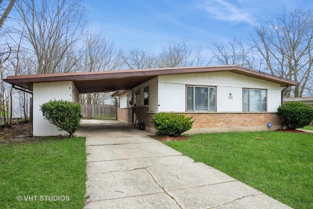 226 Shabbona Dr, Park Forest, IL 60466 - ranch-style house featuring driveway, a front yard, an attached carport, and brick siding