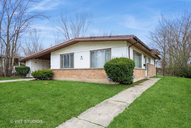 226 Shabbona Dr, Park Forest, IL 60466 - view of home's exterior with brick siding and a lawn