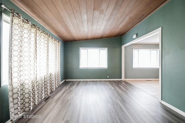 226 Shabbona Dr, Park Forest, IL 60466 - unfurnished room with wooden ceiling, wood finished floors, visible vents, and plenty of natural light