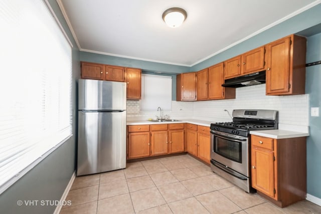 226 Shabbona Dr, Park Forest, IL 60466 - kitchen featuring appliances with stainless steel finishes, a sink, plenty of natural light, and under cabinet range hood