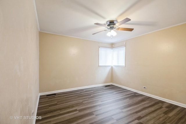 226 Shabbona Dr, Park Forest, IL 60466 - spare room featuring dark wood-style flooring, baseboards, crown molding, and ceiling fan